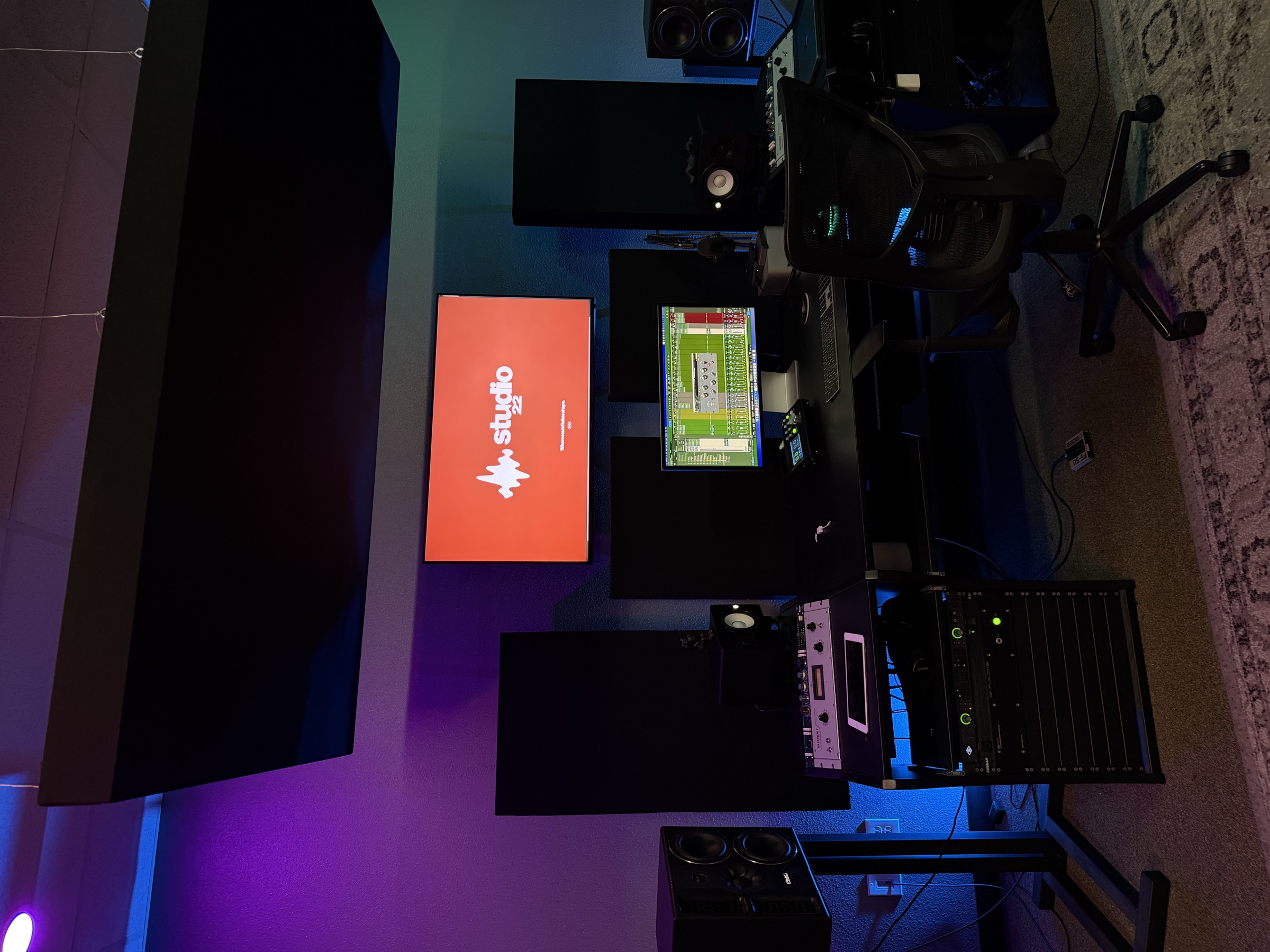 Studio 22 control room with dual monitors and red Studio 22 display