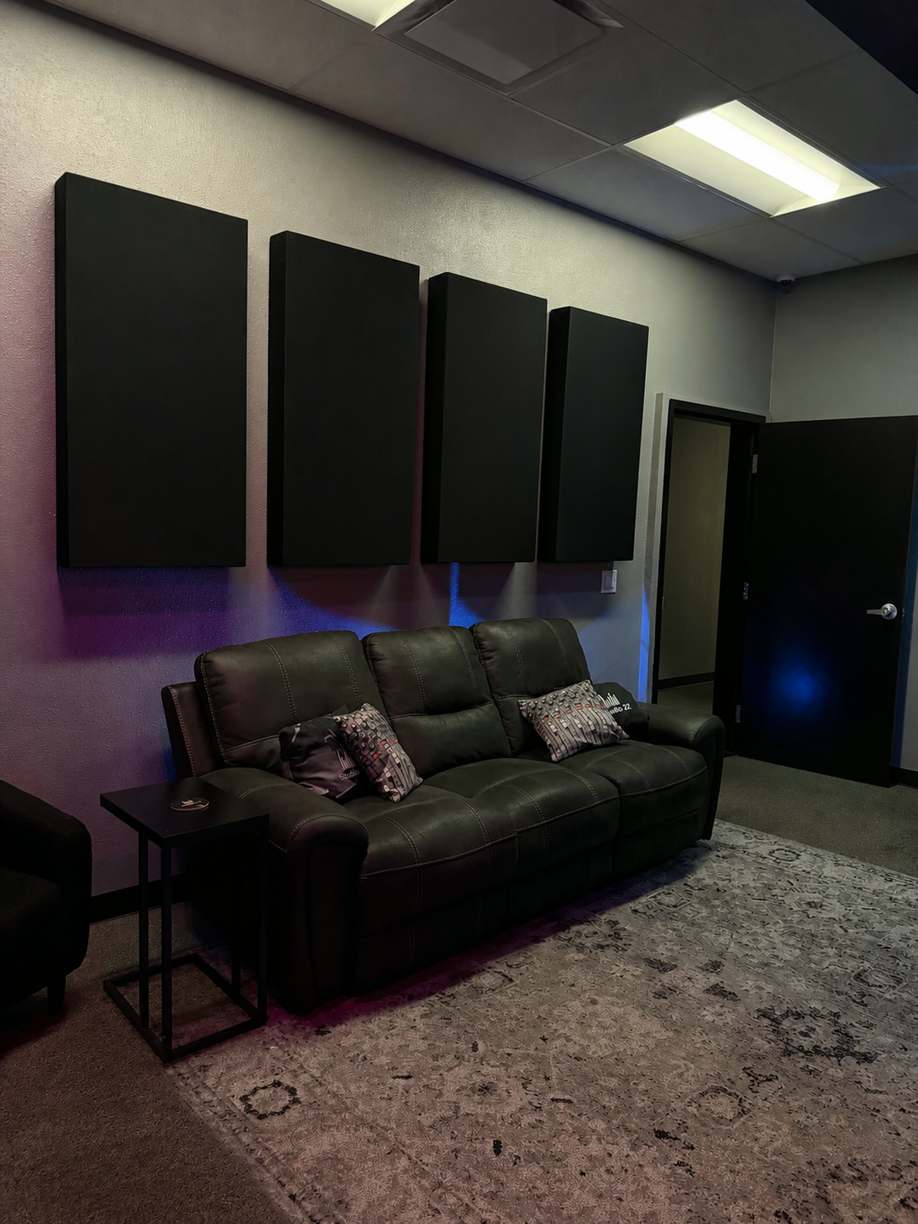 Studio 22 lounge seating beside acoustic wall treatment